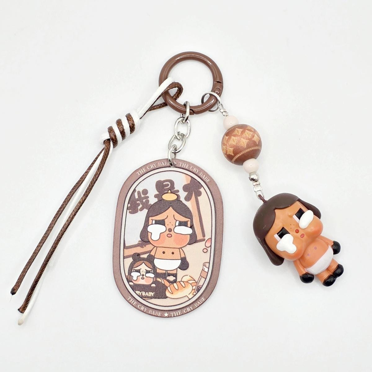 StudioNisy Mini Bean Crybaby Crying Again handmade custom medium sized bean beaded keychain or phone charm